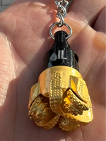 Oil drill bit keychain black and gold